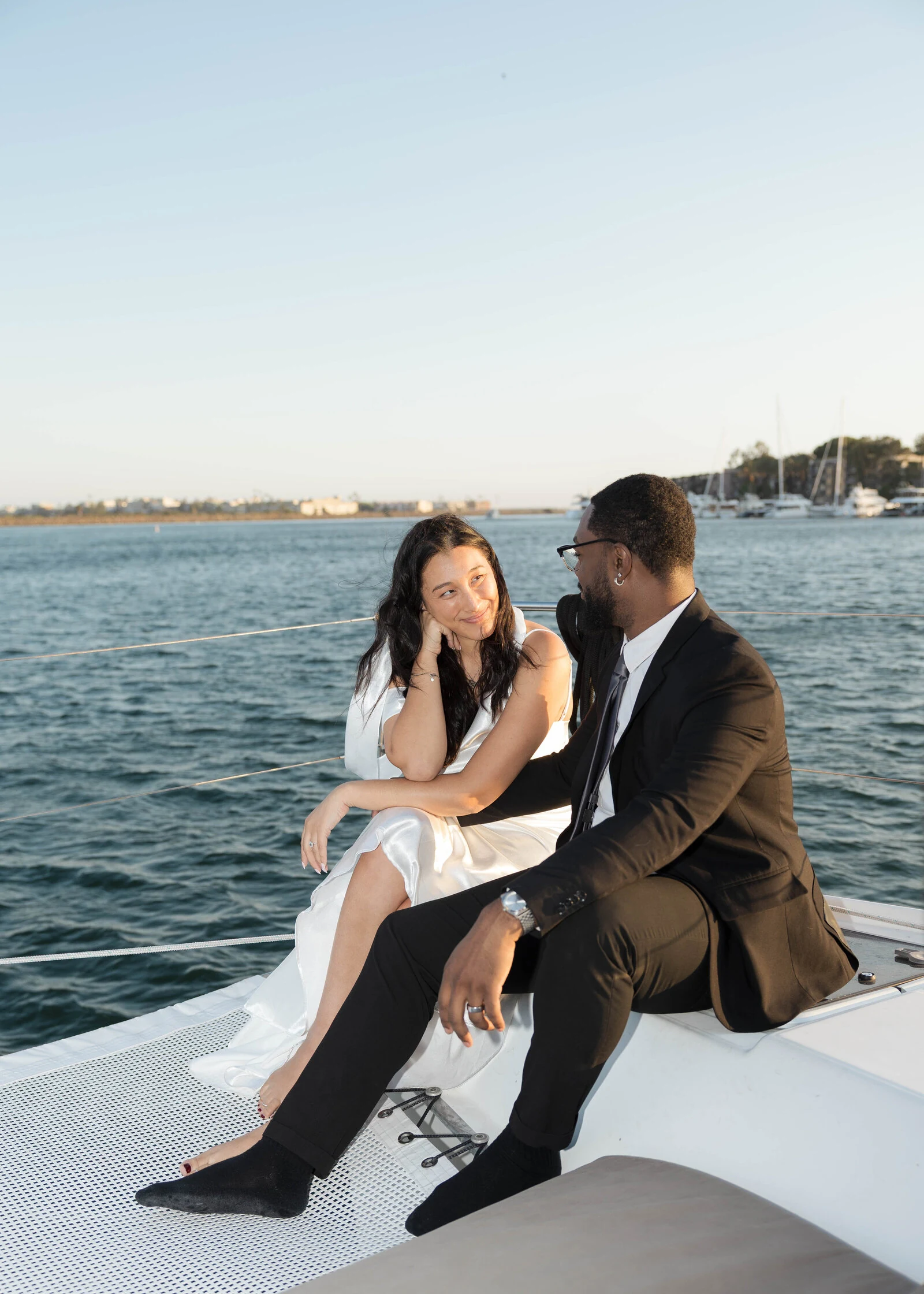 Couple looking at each other on a boat in Santa Monica