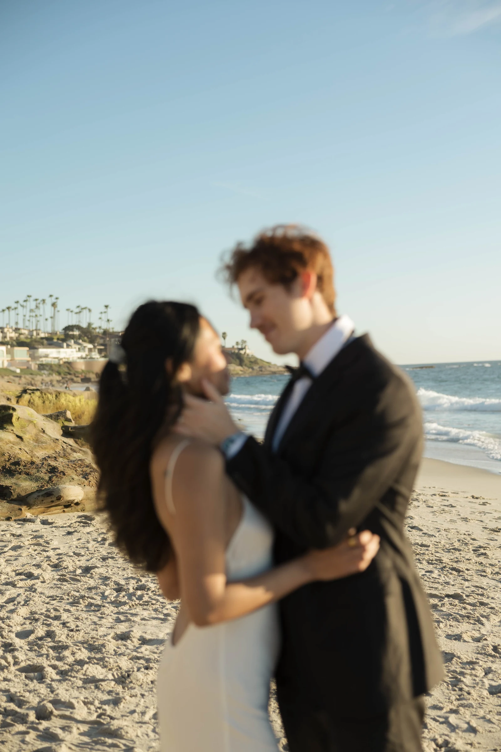Couple looking at each other during San Diego beach elopement